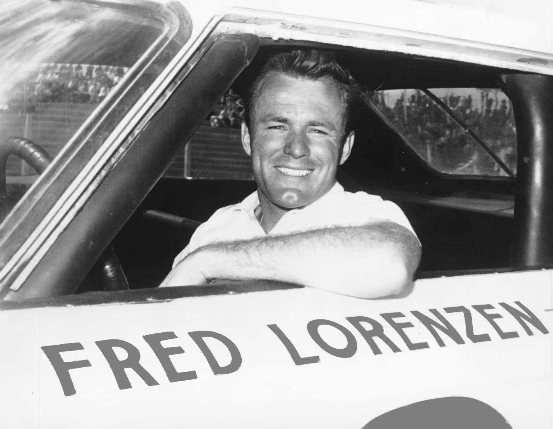Fred Lorenzen smiling from the driver’s seat of his race car