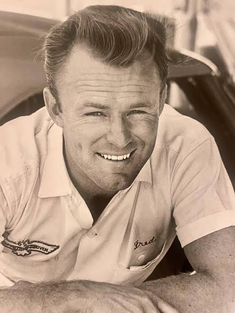 A young Fred Lorenzen smiling at the racetrack
